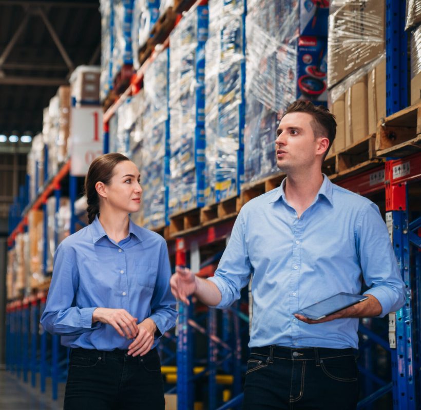 Warehouse worker working and checking the stock in the warehouse. 
Factory manager using digital tablet check barcode in industry factory logistic.